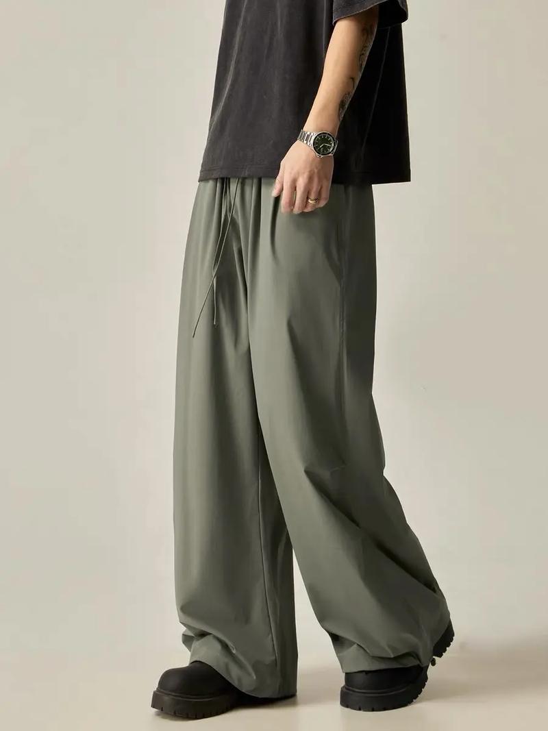 灰绿色裤子最佳配色表_绿色裤子百搭时尚，搭配多款上衣打造不同风格